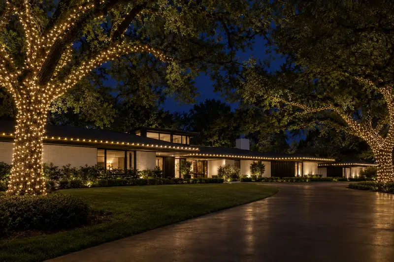 Midcentury estate in Preston Hollow Dallas with full property warm white holiday lighting