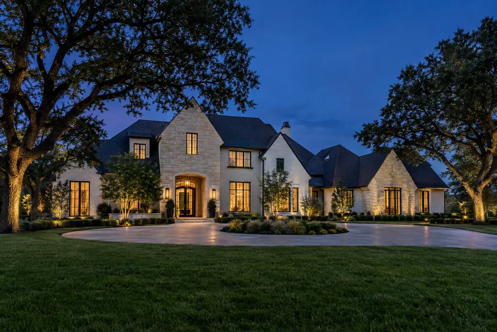 Upscale Dallas–Fort Worth home at blue hour before Christmas lighting is switched on
