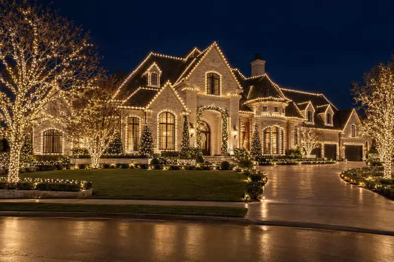 Full property Christmas lighting design covering roofline, trees and landscape of a large estate