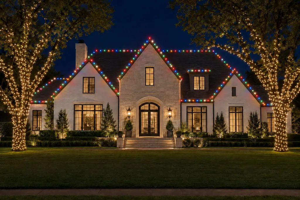 The same home shown with a classic multicolour Christmas lighting scheme